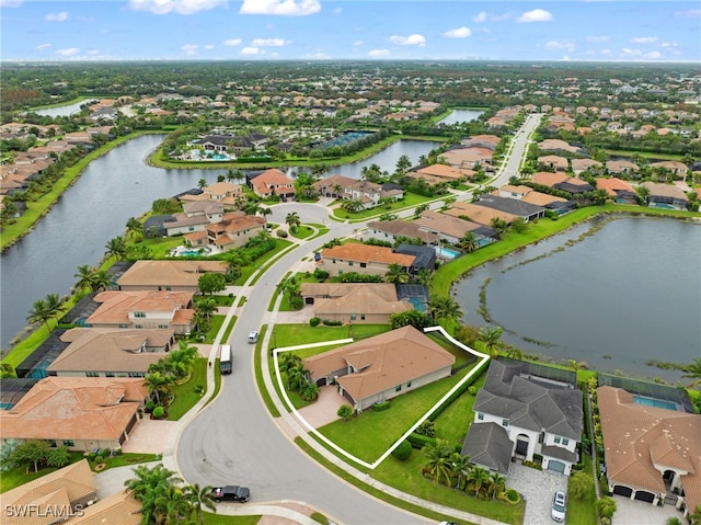 birds eye view of property featuring a water view