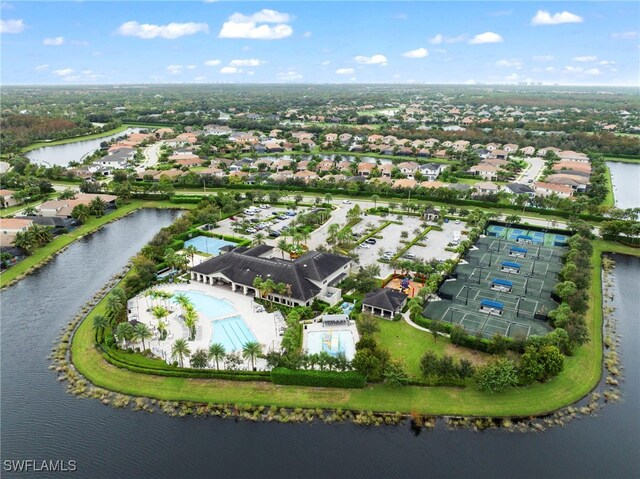 4365 Caldera Cir, Naples, FL 34119 - aerial perspective of suburban area with a pool area and a large body of water