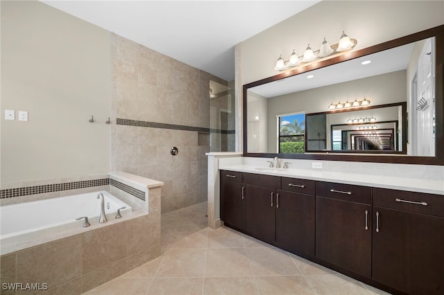 bathroom featuring tile patterned flooring, vanity, and independent shower and bath