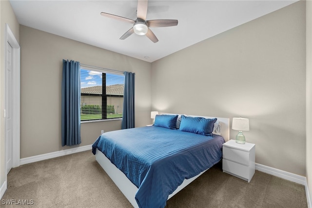 carpeted bedroom featuring ceiling fan