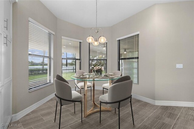 4365 Caldera Cir, Naples, FL 34119 - dining space with a chandelier and baseboards