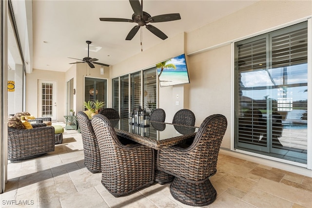 view of patio / terrace with an outdoor living space and ceiling fan