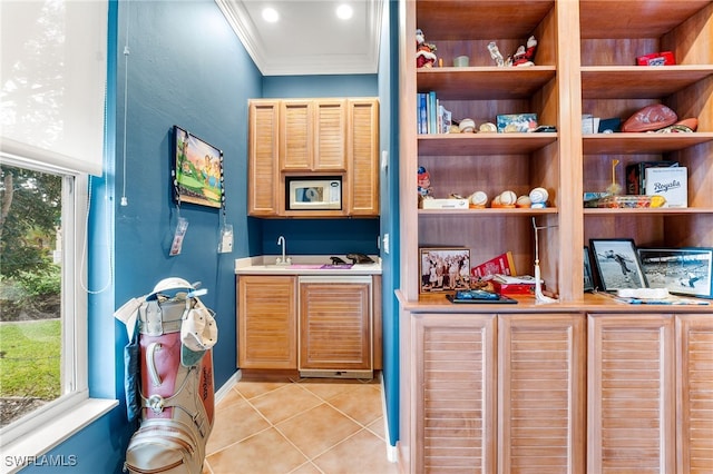 bar with built in microwave, crown molding, light tile patterned floors, and built in shelves