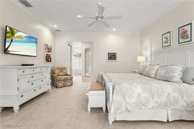 carpeted bedroom featuring ceiling fan and ornamental molding