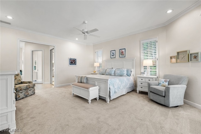 bedroom featuring crown molding, light colored carpet, and ceiling fan