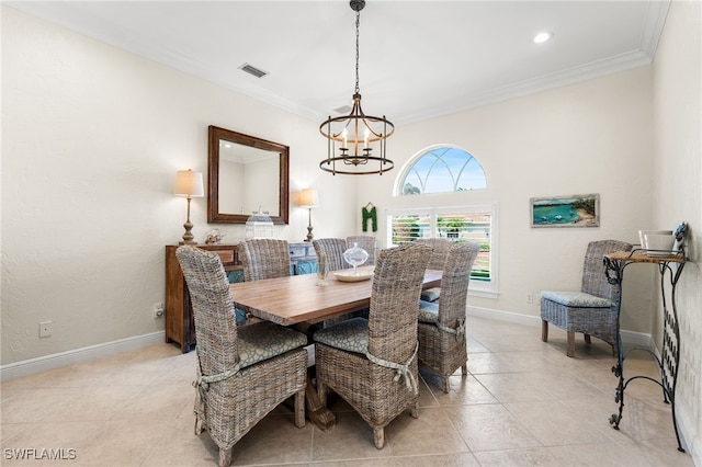 tiled dining room with ornamental molding and a notable chandelier