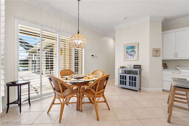 tiled dining space featuring a notable chandelier and crown molding