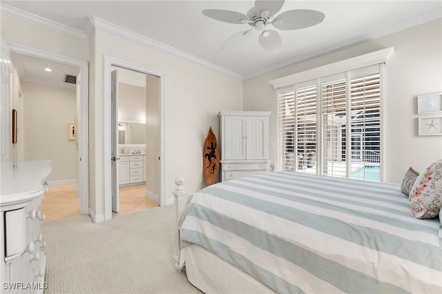 carpeted bedroom with ornamental molding, ensuite bathroom, and multiple windows