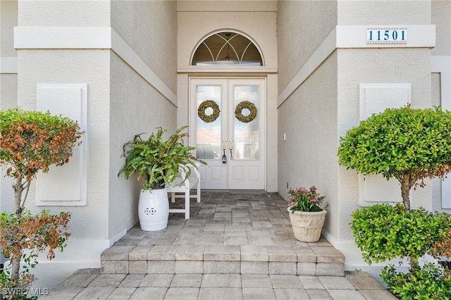 property entrance featuring french doors