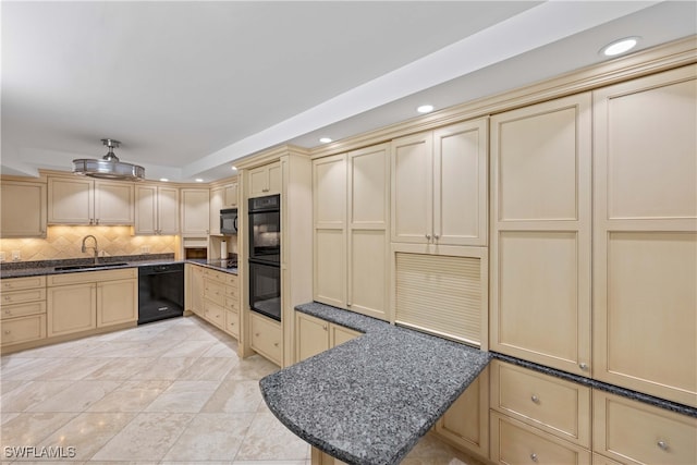 kitchen featuring tasteful backsplash, black appliances, sink, kitchen peninsula, and dark stone counters