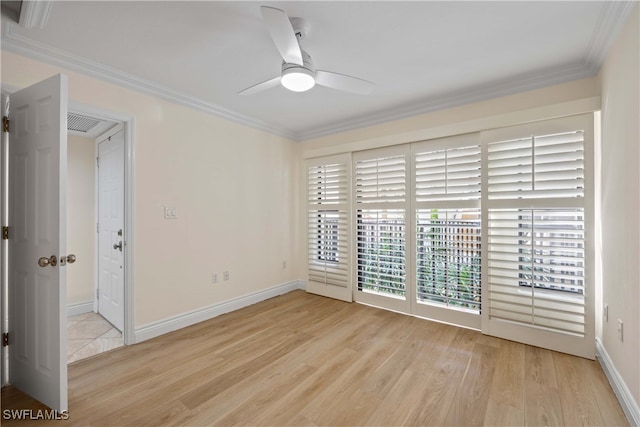 empty room with light hardwood / wood-style flooring, ceiling fan, and crown molding