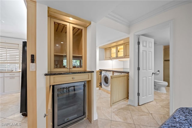 interior space featuring ornamental molding, wine cooler, and washer / dryer