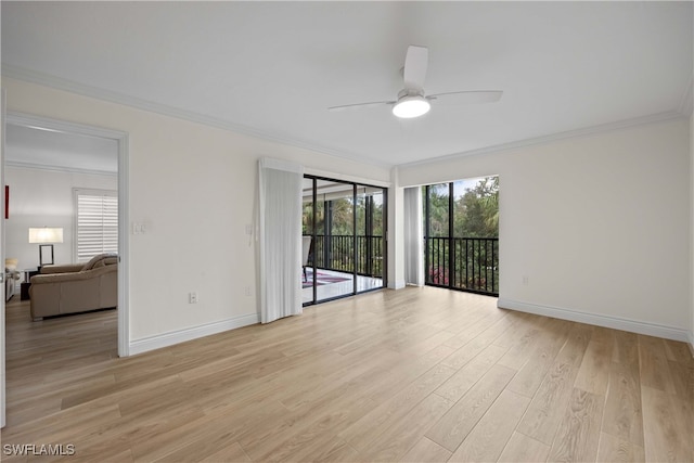 empty room with ceiling fan, ornamental molding, and light wood-type flooring