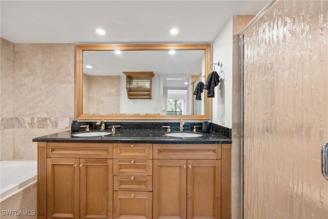 bathroom featuring vanity, tile walls, and separate shower and tub