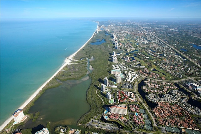 aerial view with a water view and a view of the beach