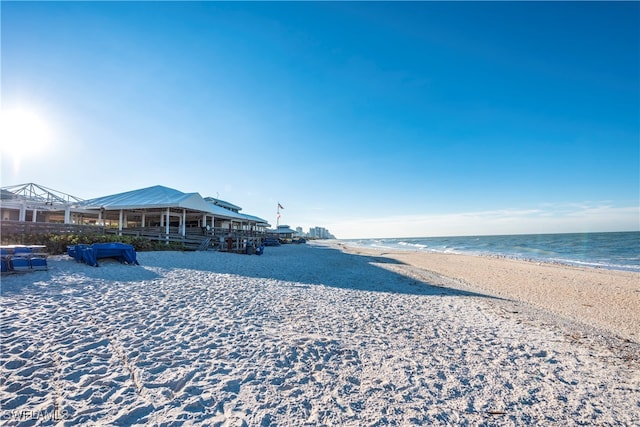 property view of water featuring a beach view