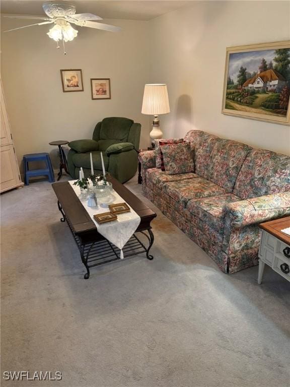 living room with light colored carpet and ceiling fan