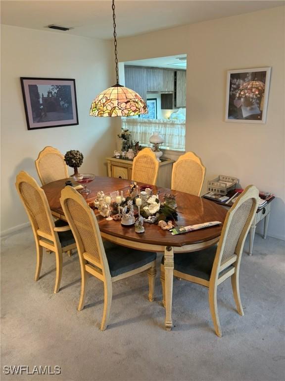 view of carpeted dining space