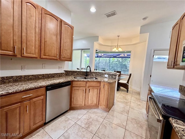 kitchen featuring pendant lighting, sink, appliances with stainless steel finishes, a notable chandelier, and light tile patterned flooring