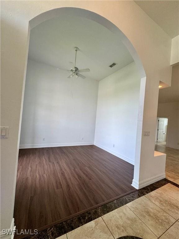 spare room featuring ceiling fan and vaulted ceiling