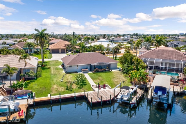 birds eye view of property featuring a water view