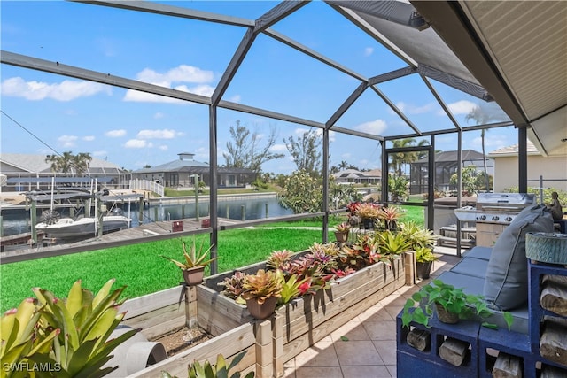 view of patio featuring a boat dock, a lanai, and a water view