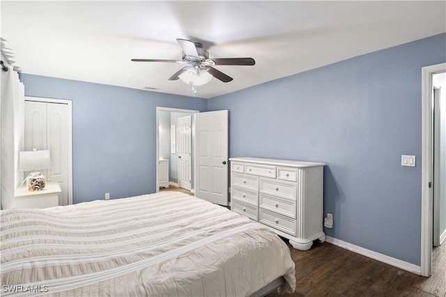 bedroom with a closet, dark hardwood / wood-style floors, and ceiling fan