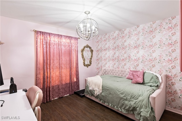 bedroom featuring dark hardwood / wood-style flooring and an inviting chandelier