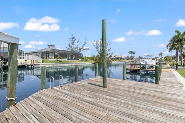 dock area with a water view and glass enclosure