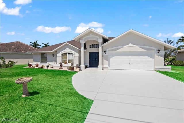 view of front facade with a front yard and a garage