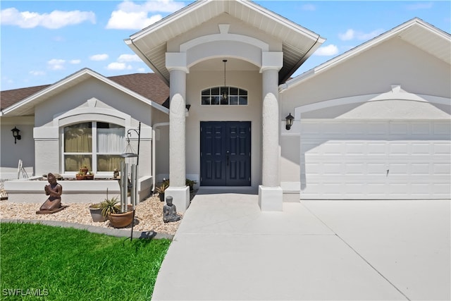 view of exterior entry featuring a garage