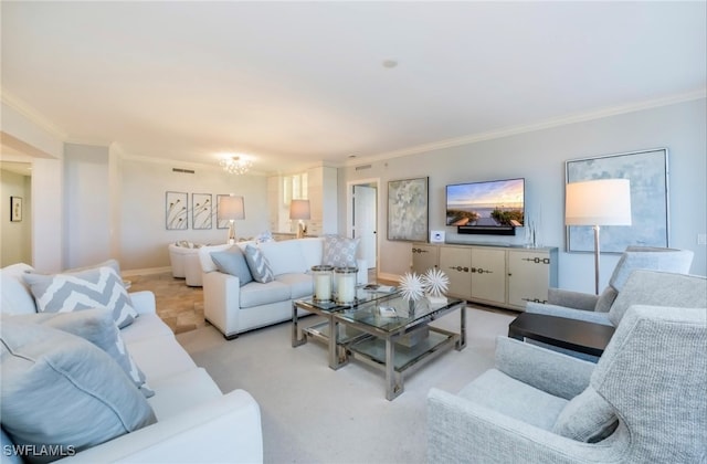 living room featuring crown molding, light carpet, and an inviting chandelier