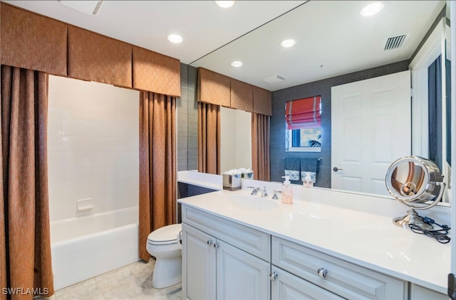 full bathroom featuring vanity, toilet, tile patterned floors, and shower / tub combo