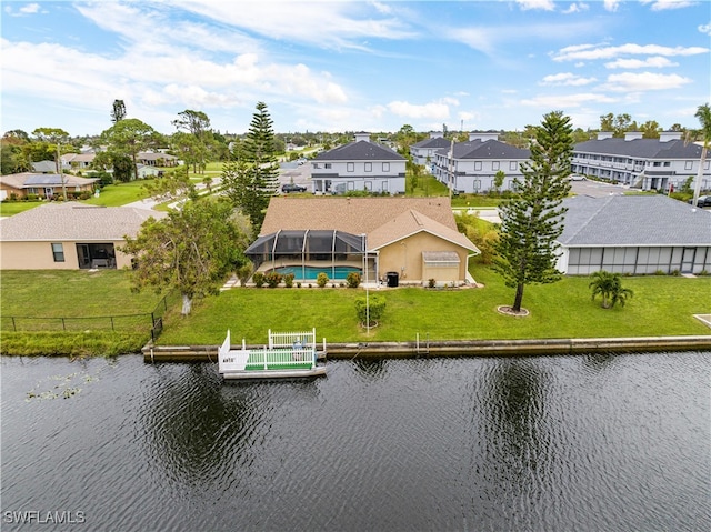 birds eye view of property with a water view