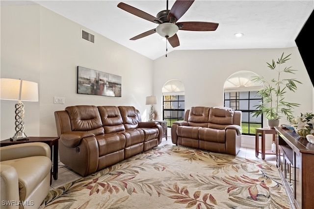 living room with vaulted ceiling, a healthy amount of sunlight, and ceiling fan