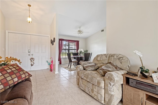 tiled living room featuring ceiling fan