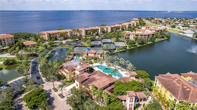 birds eye view of property with a water view