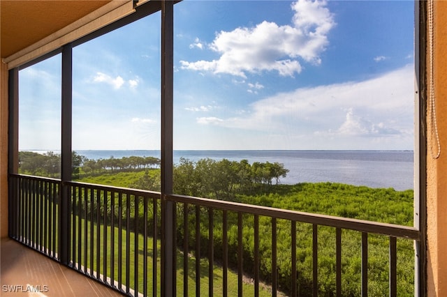 balcony featuring a water view