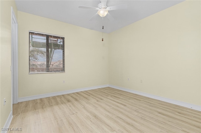 empty room featuring ceiling fan and light hardwood / wood-style floors