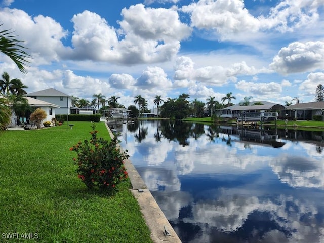 water view with a dock and a residential view