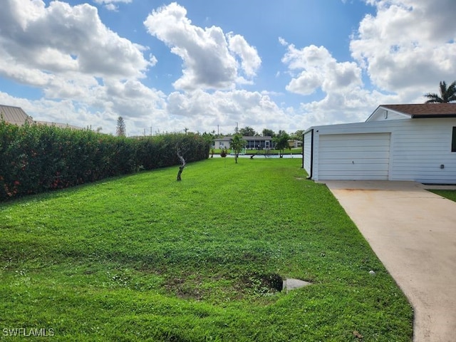 view of yard featuring a garage