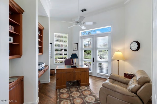 office space with ceiling fan, wood finished floors, visible vents, french doors, and crown molding