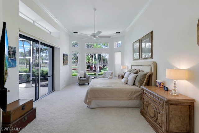 bedroom featuring light carpet, access to outside, ornamental molding, and multiple windows