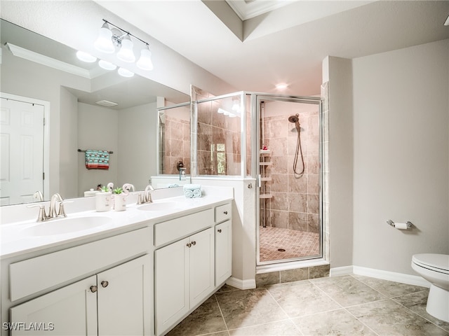 bathroom featuring tile patterned flooring, vanity, ornamental molding, and a shower with door