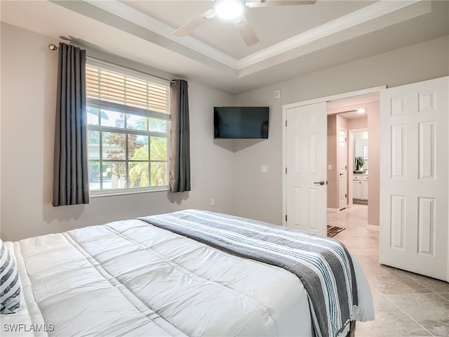 bedroom featuring a tray ceiling, ceiling fan, and ornamental molding