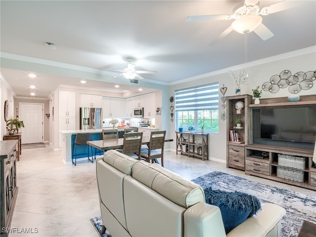 tiled living room featuring ceiling fan and ornamental molding