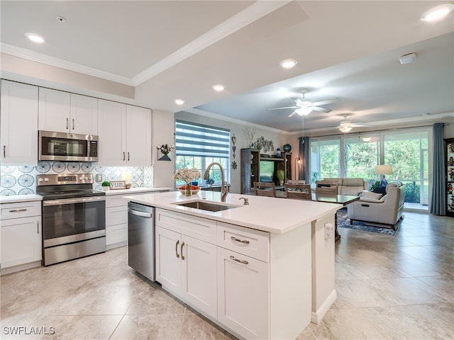 kitchen with white cabinetry, sink, a healthy amount of sunlight, and appliances with stainless steel finishes