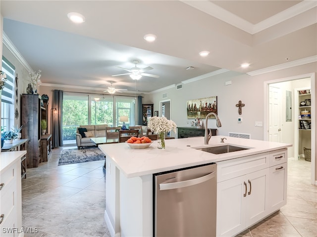 kitchen with white cabinetry, sink, stainless steel dishwasher, a kitchen island with sink, and ornamental molding