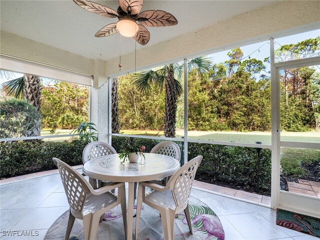 sunroom / solarium with ceiling fan