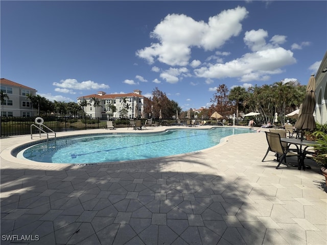 view of swimming pool featuring a patio area